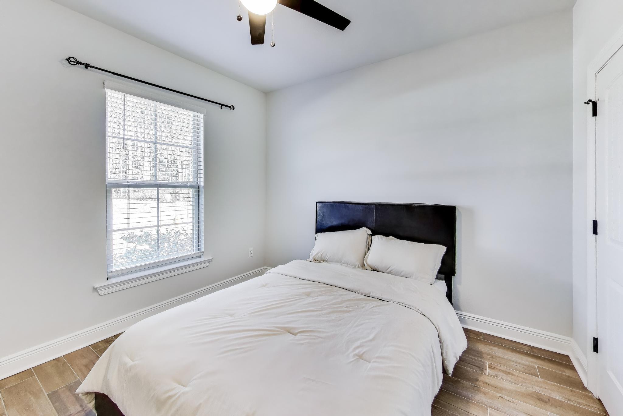 46 East Tweet Street Freeport, FL 32439 - Photo 28 of 59 a large bed sitting in a bedroom next to a window