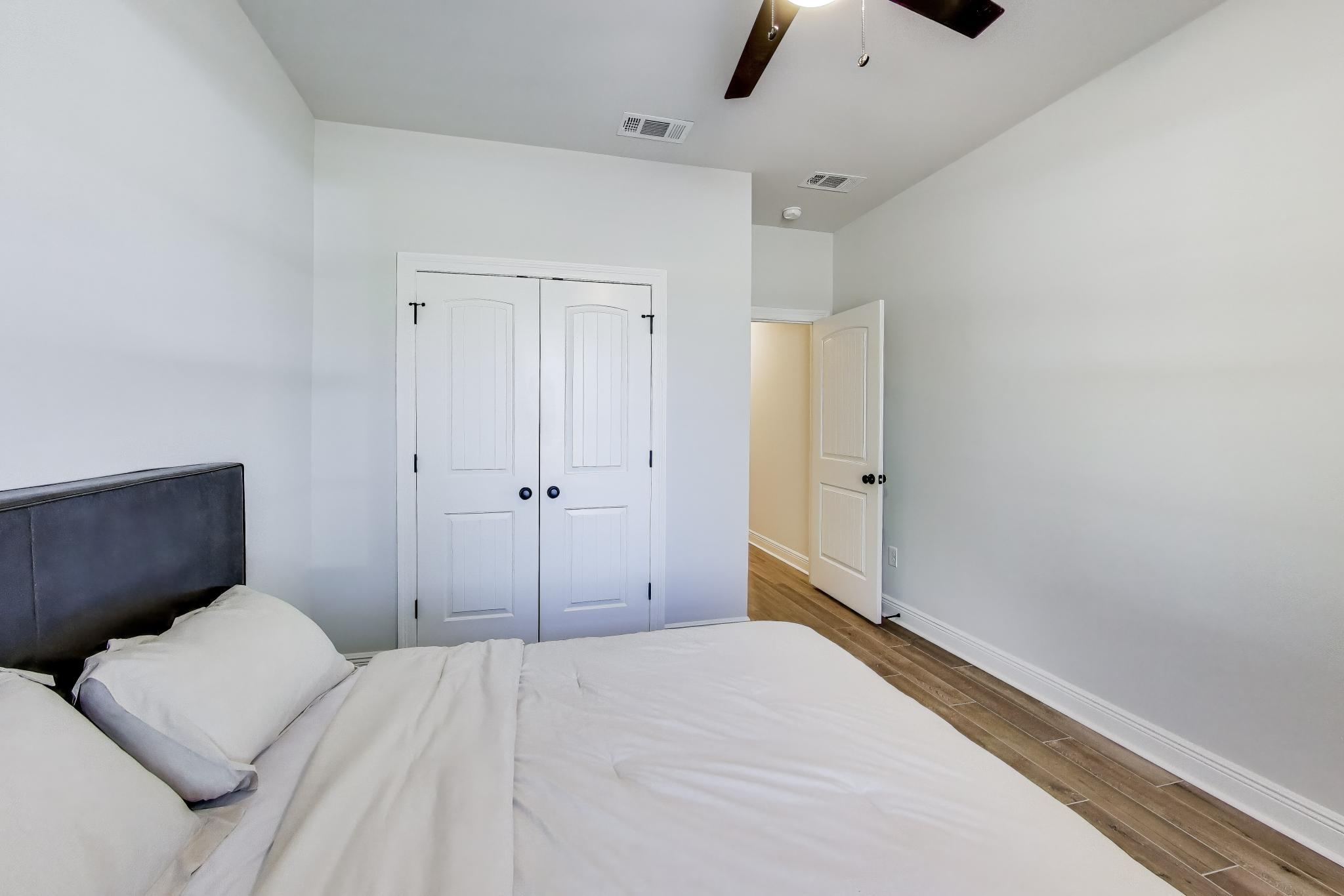 46 East Tweet Street Freeport, FL 32439 - Photo 29 of 59 a bedroom with a bed and a cabinet