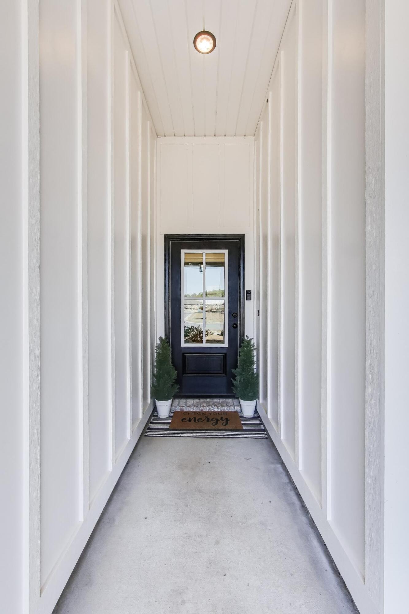 46 East Tweet Street Freeport, FL 32439 - Photo 3 of 59 a view of a hallway with wooden floor and a window
