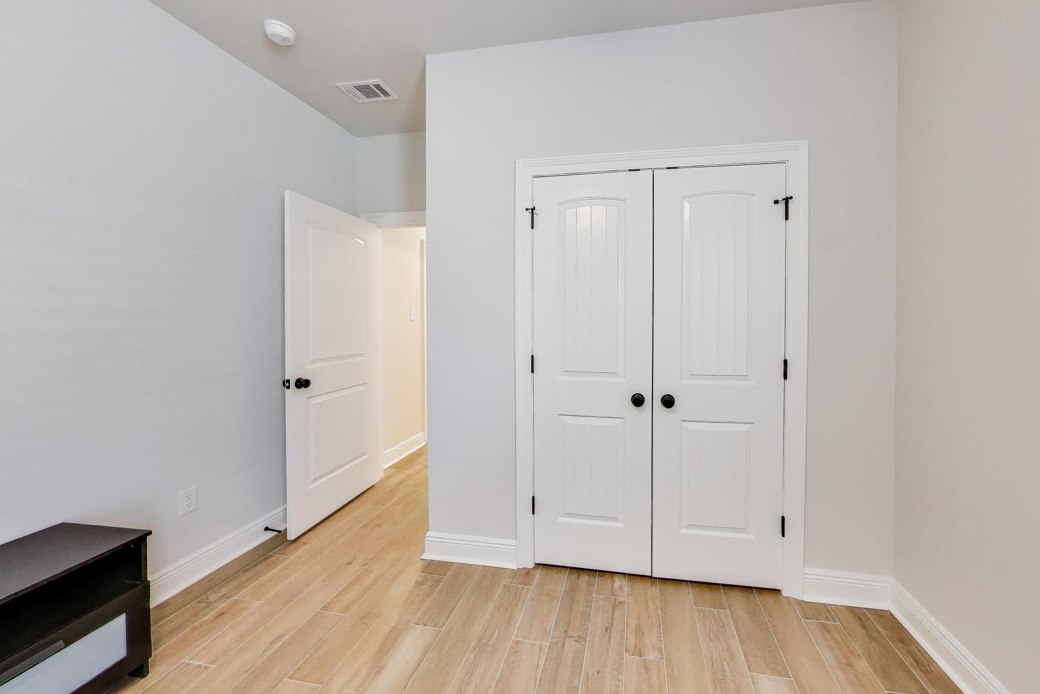 46 East Tweet Street Freeport, FL 32439 - Photo 31 of 59 a view of an empty room with wooden floor