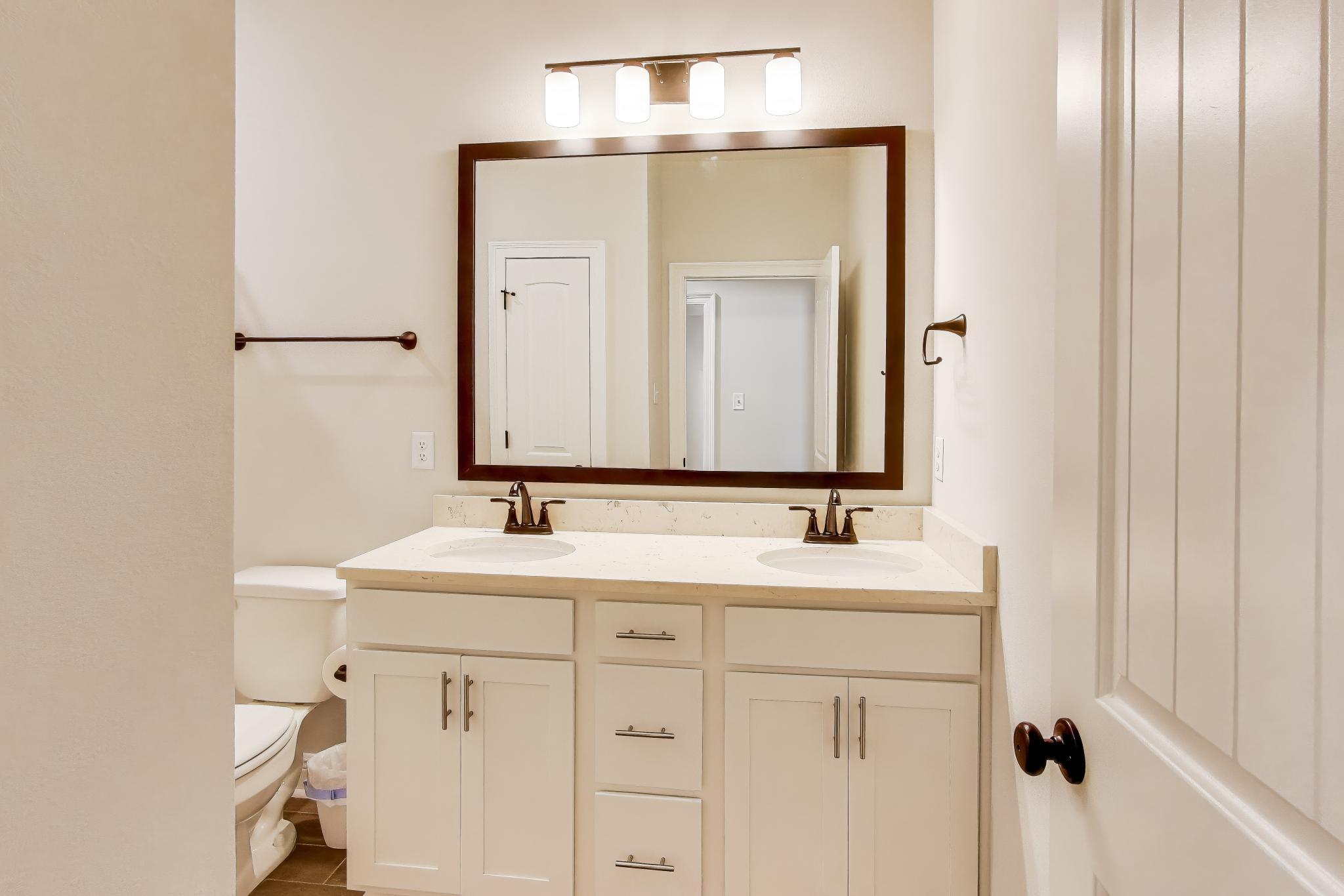 46 East Tweet Street Freeport, FL 32439 - Photo 33 of 59 a bathroom with a sink and a mirror