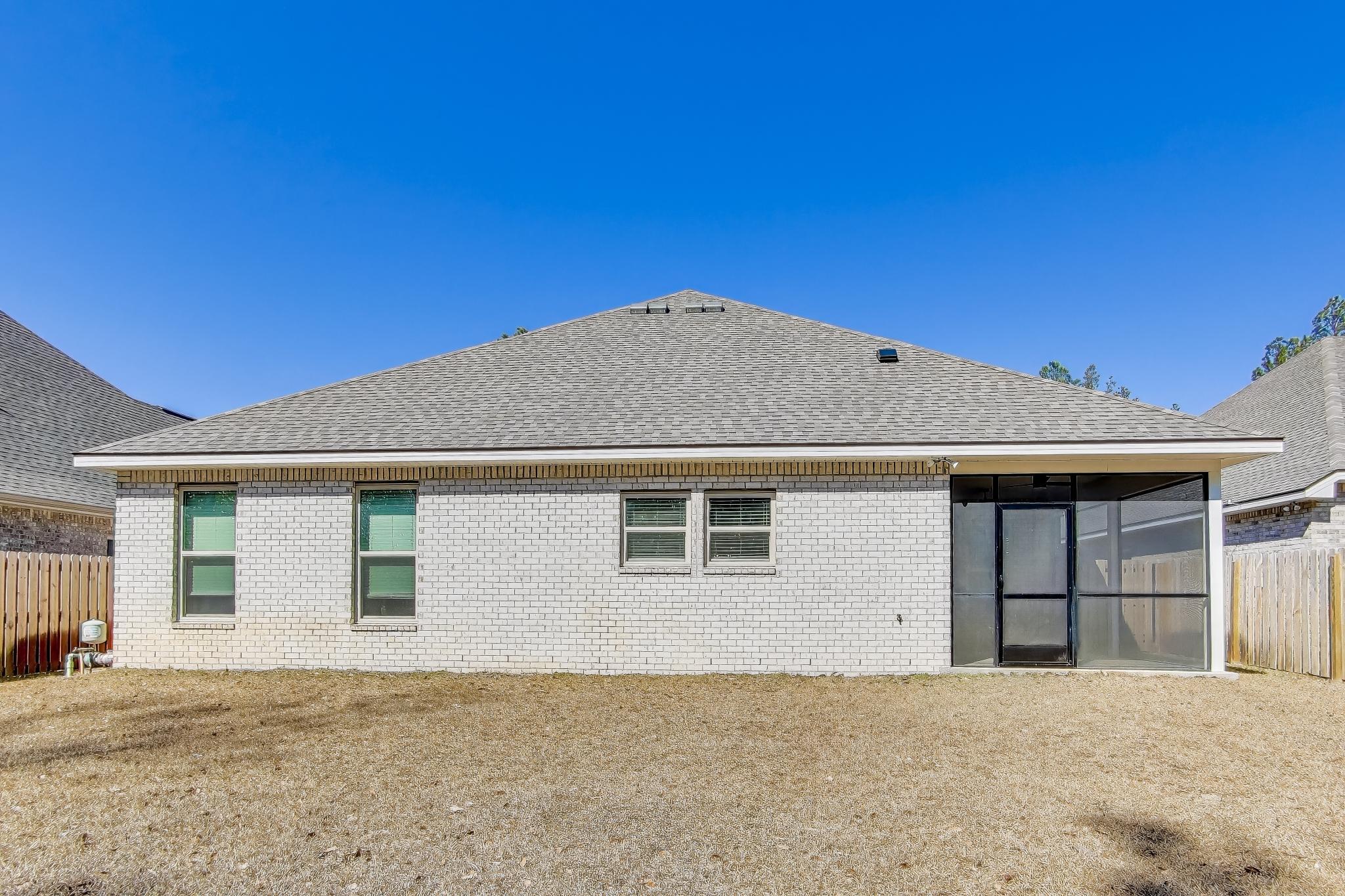 46 East Tweet Street Freeport, FL 32439 - Photo 37 of 59 a front view of a house with a yard