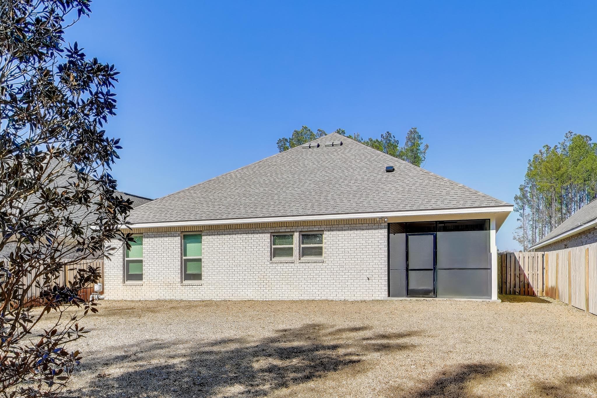 46 East Tweet Street Freeport, FL 32439 - Photo 38 of 59 a front view of a house with a yard