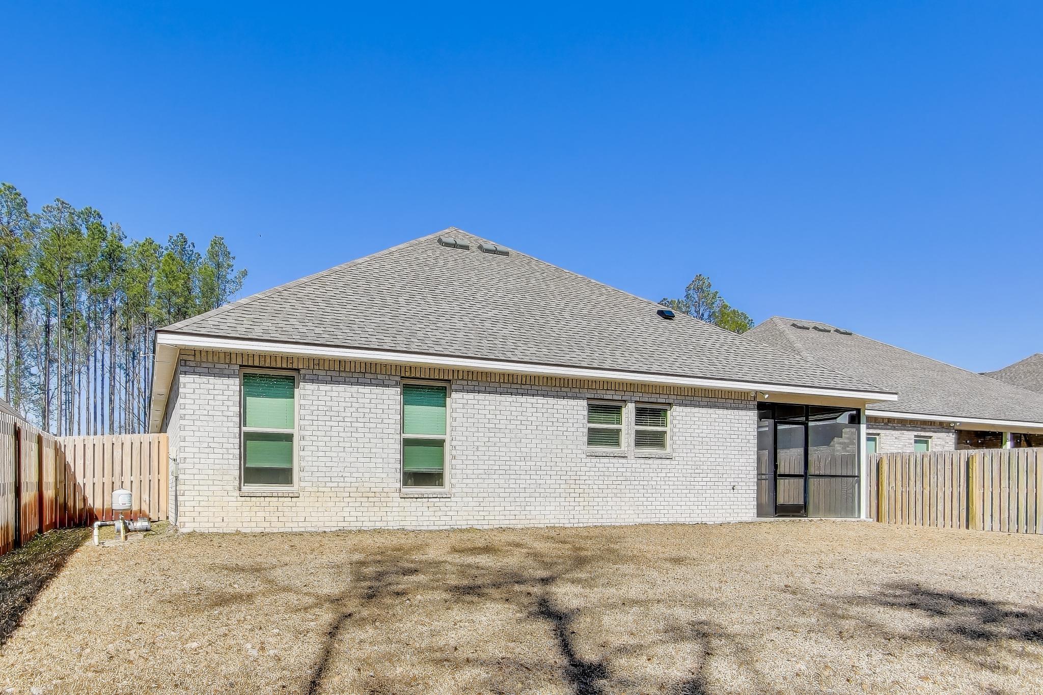 46 East Tweet Street Freeport, FL 32439 - Photo 39 of 59 a front view of a house with a yard