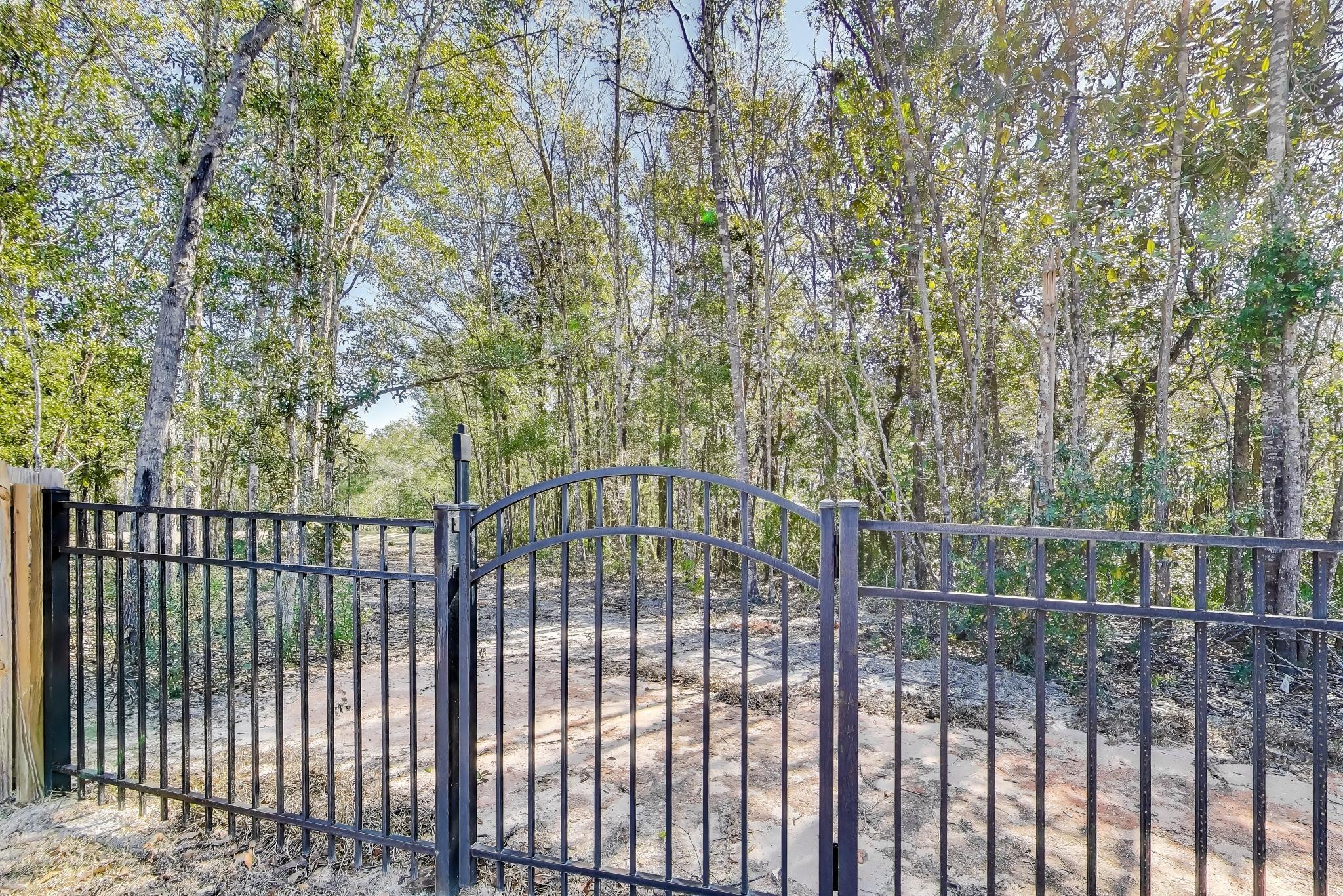 46 East Tweet Street Freeport, FL 32439 - Photo 43 of 59 gate to fishing pond