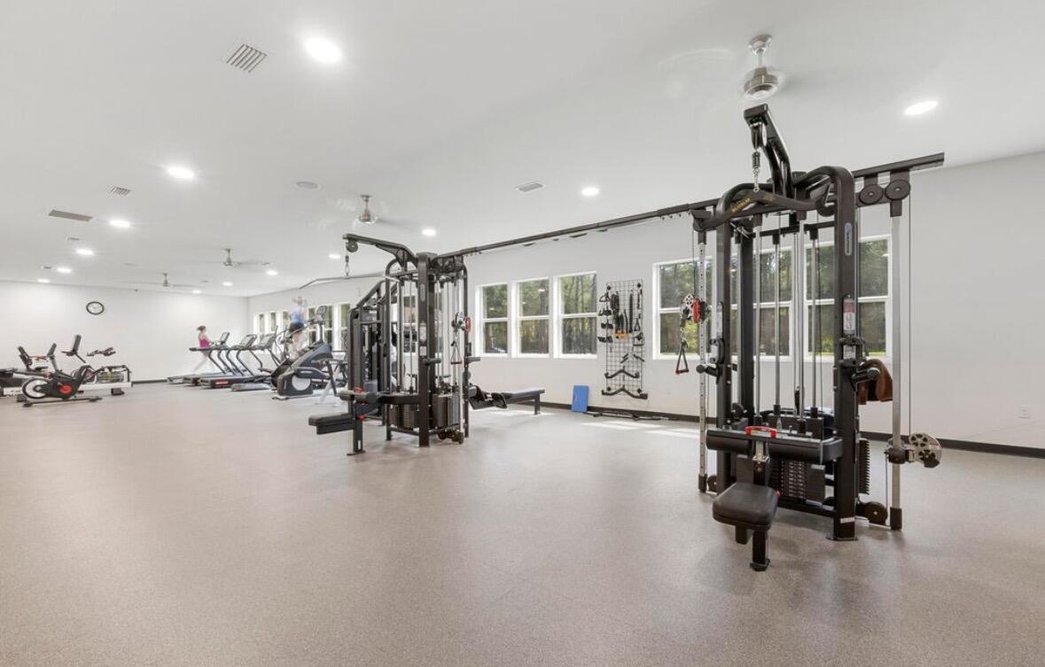 46 East Tweet Street Freeport, FL 32439 - Photo 48 of 59 a view of a room with gym equipment and a view of living room