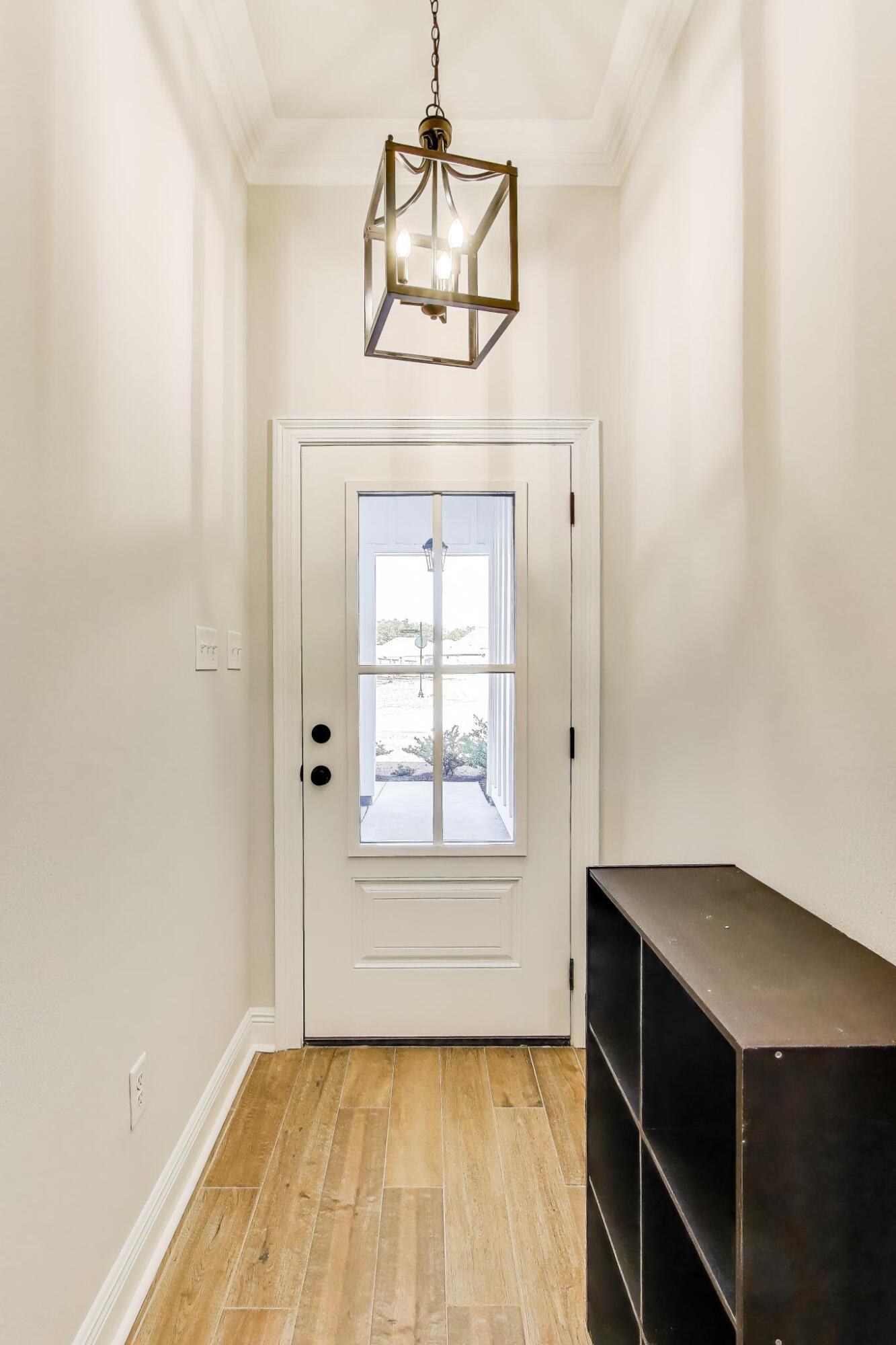 46 East Tweet Street Freeport, FL 32439 - Photo 5 of 59 a view of empty room with wooden floor and fan