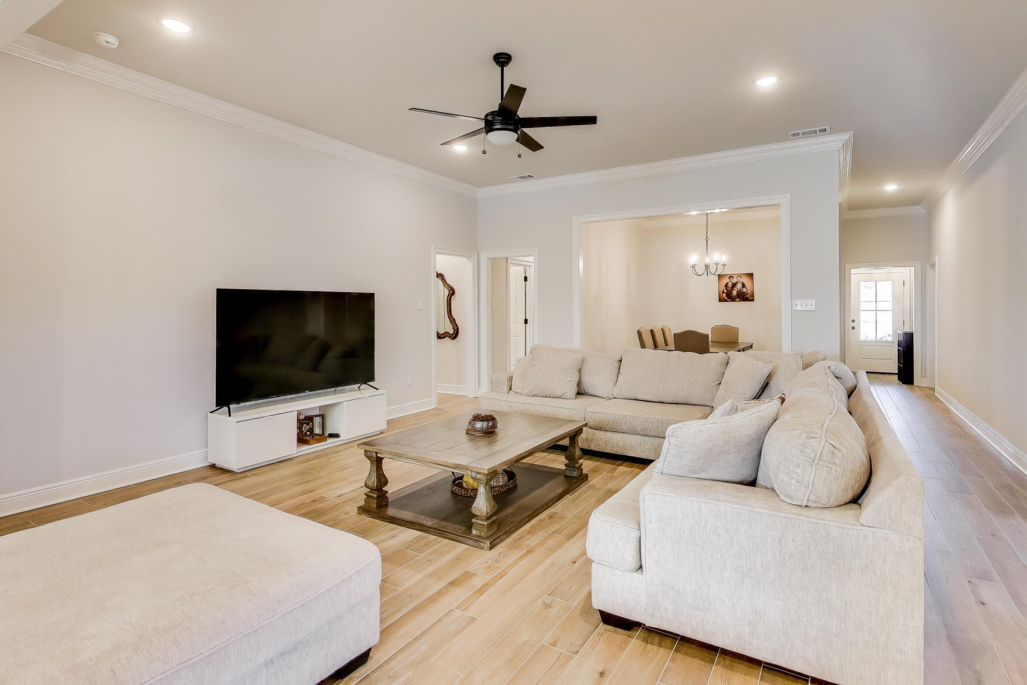 46 East Tweet Street Freeport, FL 32439 - Photo 6 of 59 a living room with furniture and a flat screen tv