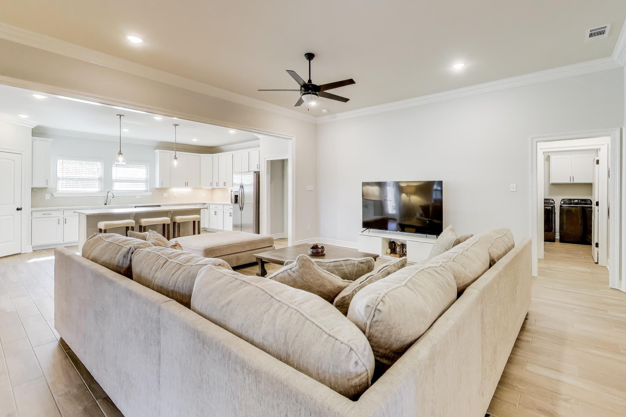 46 East Tweet Street Freeport, FL 32439 - Photo 8 of 59 a living room with furniture and a flat screen tv