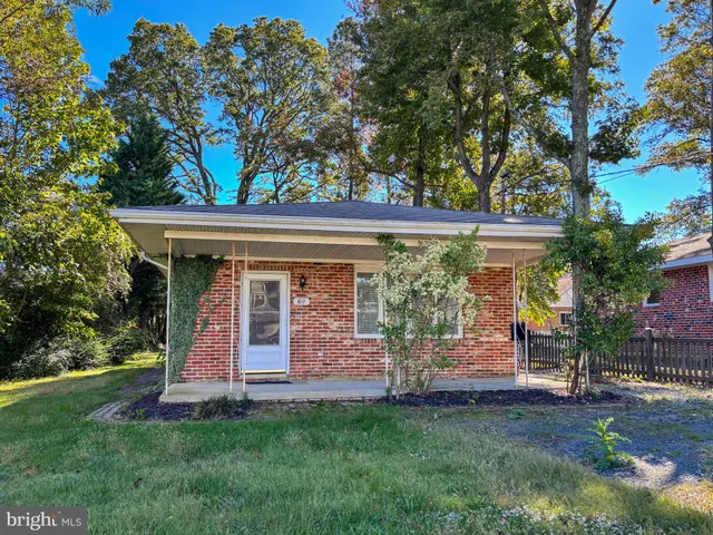 front view of a house with a garden
