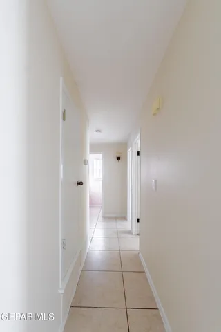 a bathroom with a granite countertop bathtub sink vanity mirror and toilet