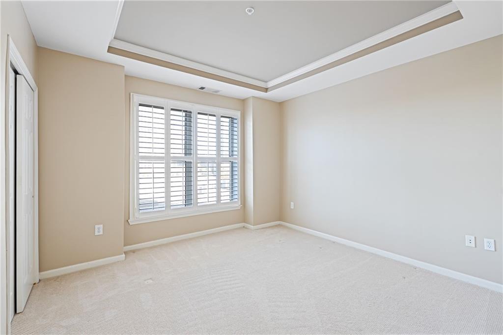 3334 Peachtree Road Northeast, Unit 312 Atlanta, GA 30326 - Photo 12 of 79 a view of an empty room with a window