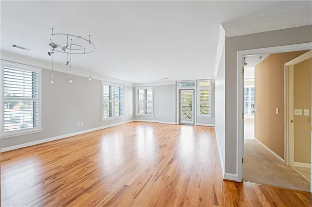 a view of an empty room with a window