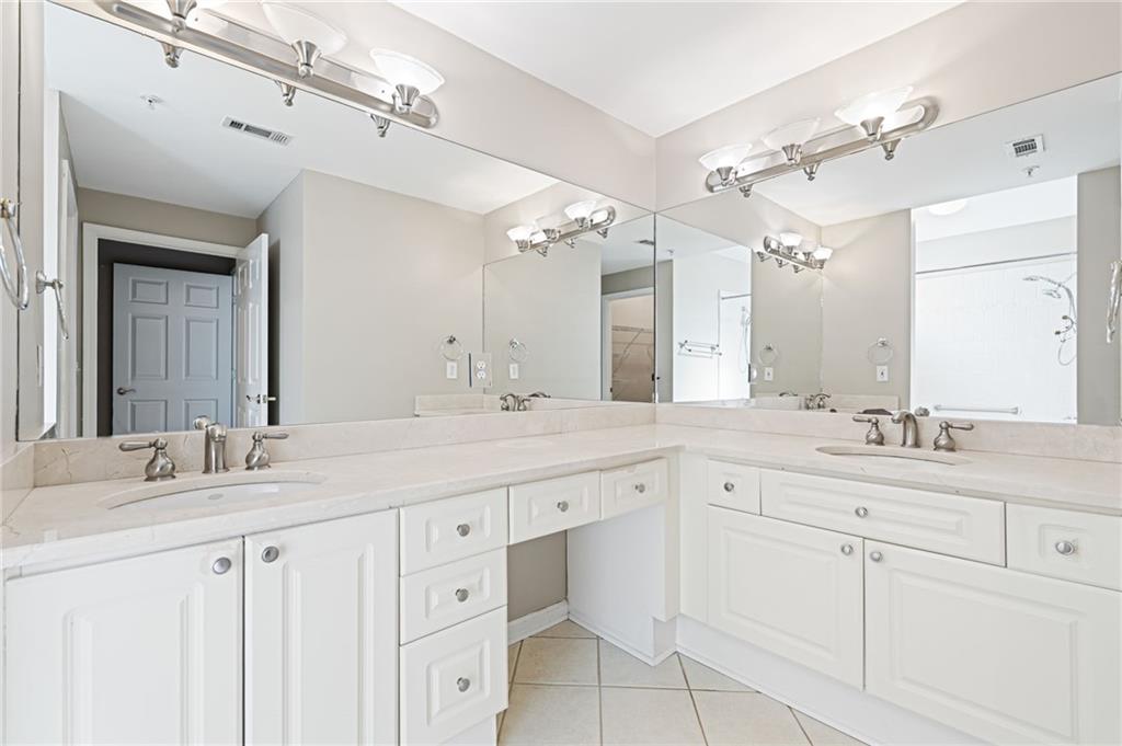 3334 Peachtree Road Northeast, Unit 312 Atlanta, GA 30326 - Photo 20 of 79 a spacious bathroom with a granite countertop sink mirror and