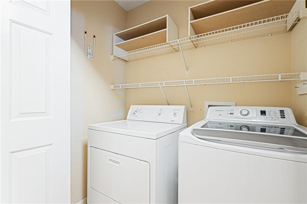 3334 Peachtree Road Northeast, Unit 312 Atlanta, GA 30326 - Photo 24 of 79 a close up of a washer and dryer