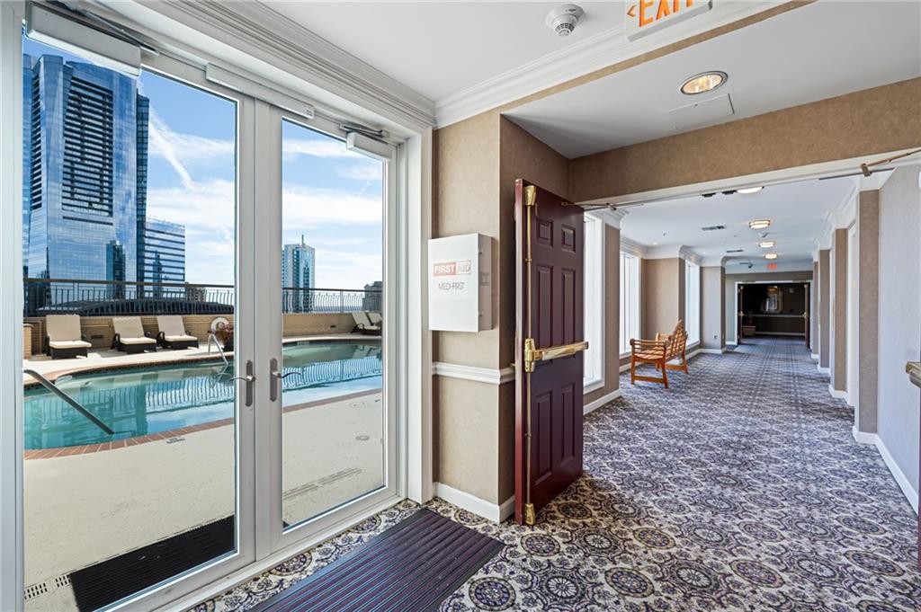 3334 Peachtree Road Northeast, Unit 312 Atlanta, GA 30326 - Photo 33 of 79 a kitchen with stainless steel appliances granite countertop a refrigerator and a sink