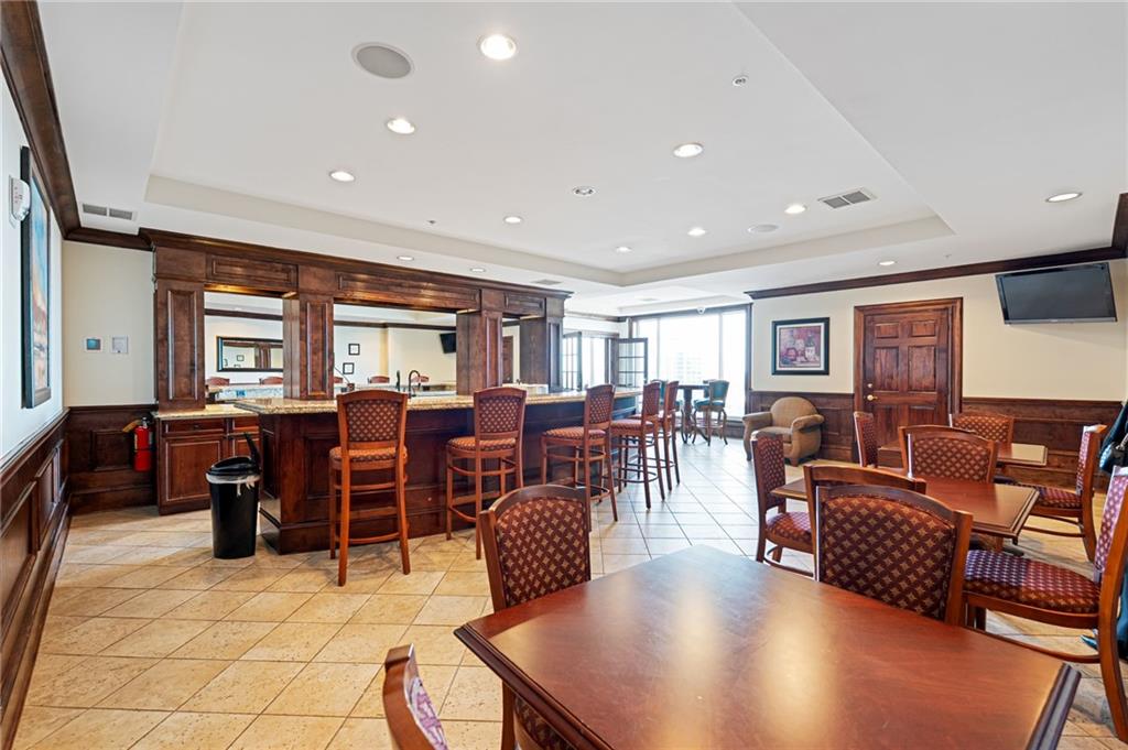 3334 Peachtree Road Northeast, Unit 312 Atlanta, GA 30326 - Photo 37 of 79 a living room with lots of furniture and kitchen view