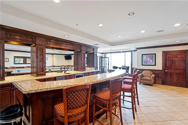 a large room with lots of white furniture