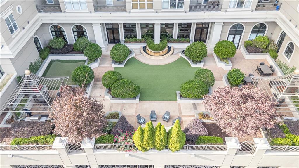 3334 Peachtree Road Northeast, Unit 312 Atlanta, GA 30326 - Photo 4 of 79 a front view of a house with garden