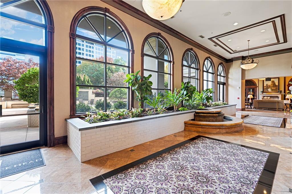 3334 Peachtree Road Northeast, Unit 312 Atlanta, GA 30326 - Photo 41 of 79 a living room with entrance gate and a large window