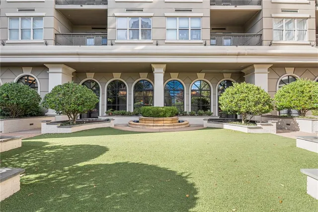 a bathroom with a sink and mirror with toilet