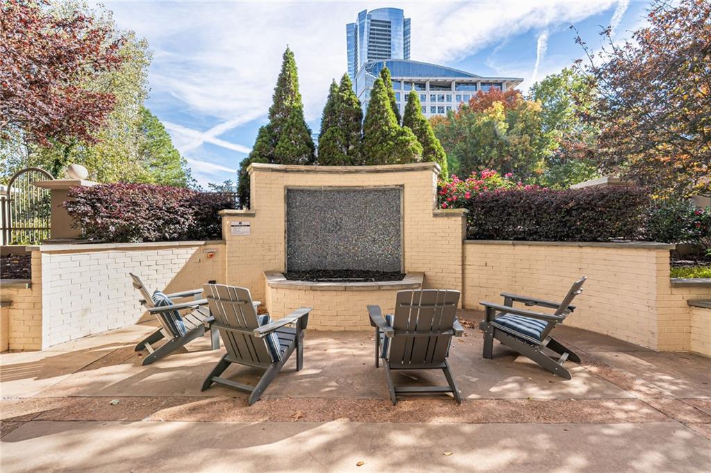 3334 Peachtree Road Northeast, Unit 312 Atlanta, GA 30326 - Photo 46 of 79 a view of a patio with a table and chairs