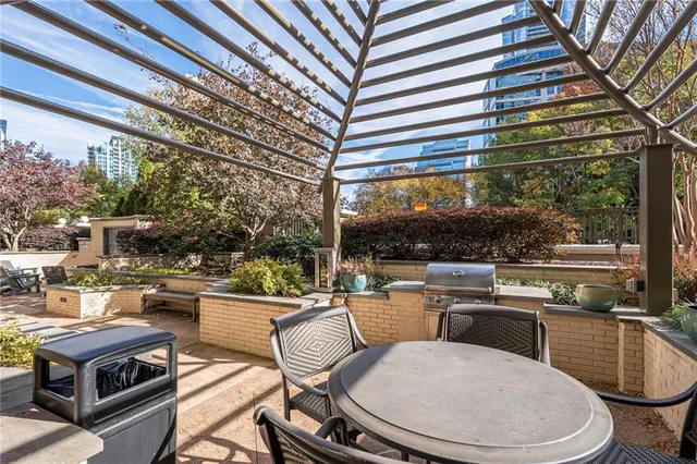 a spacious bathroom with a granite countertop sink and a large mirror