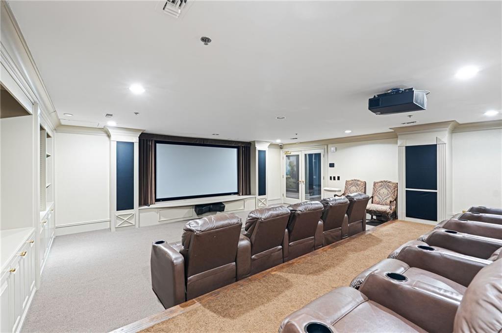 3334 Peachtree Road Northeast, Unit 312 Atlanta, GA 30326 - Photo 61 of 79 a living room with furniture and a flat screen tv