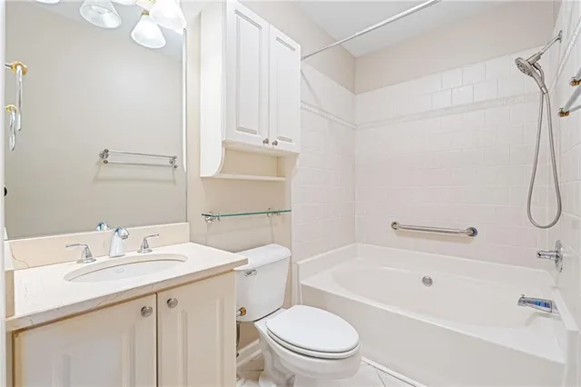 a large kitchen with cabinets wooden floor and stainless steel appliances