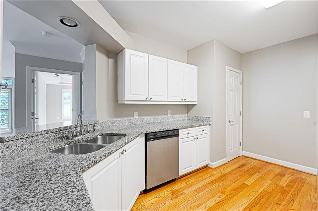3334 Peachtree Road Northeast, Unit 312 Atlanta, GA 30326 - Photo 9 of 79 a kitchen with a sink stove and cabinets