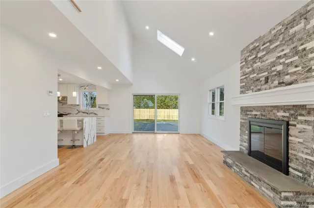 a view of kitchen and hall with wooden floor
