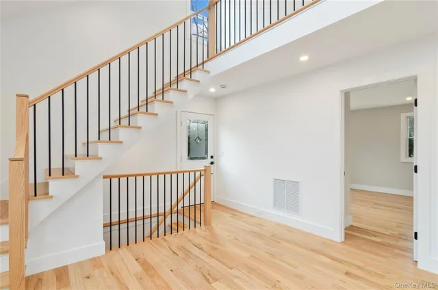 a view of empty room with a fireplace and window