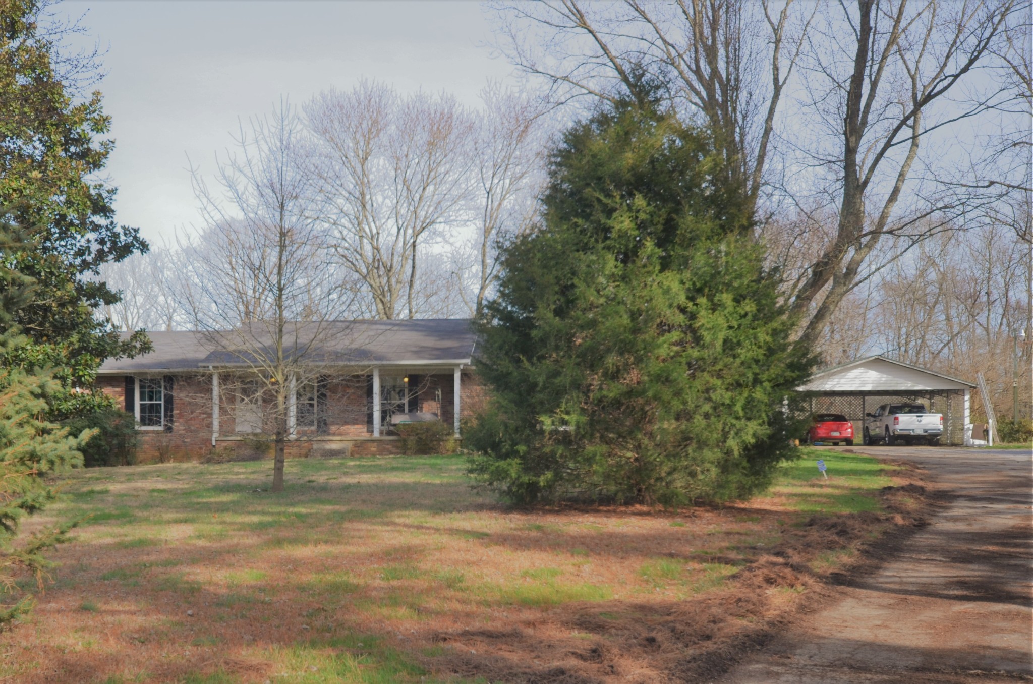 30 Remke Road Lawrenceburg, TN 38464 - Photo 2 of 49 a front view of a house with a garden