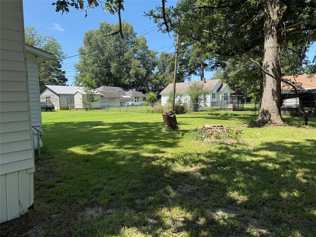 217 3rd St Pinehill Springhill, LA 71075 - Photo 20 of 23 Expansive grassy yard with mature trees