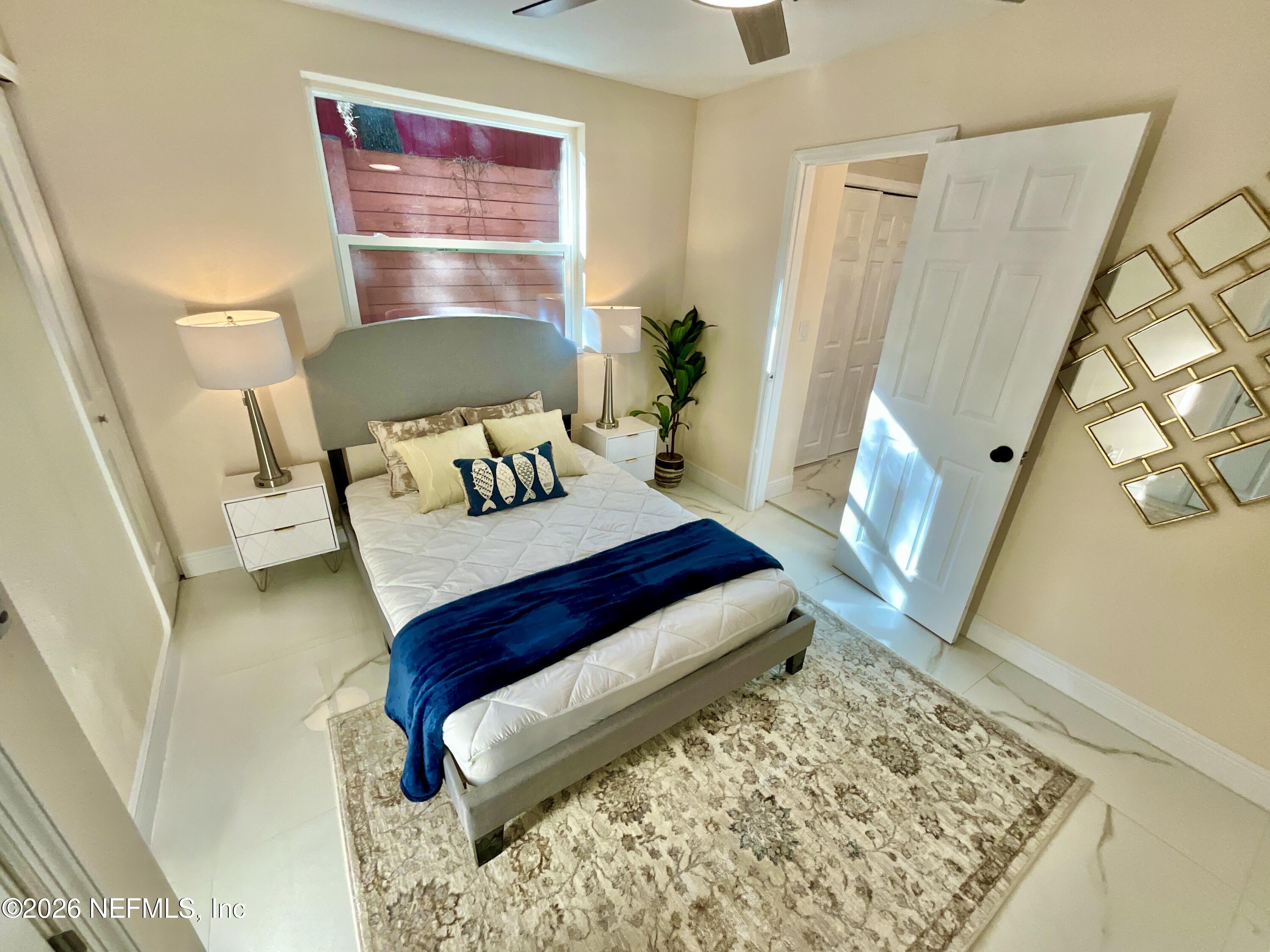 111 2nd Street Melrose, FL 32666 - Photo 15 of 36 a living room with furniture and a wooden floor