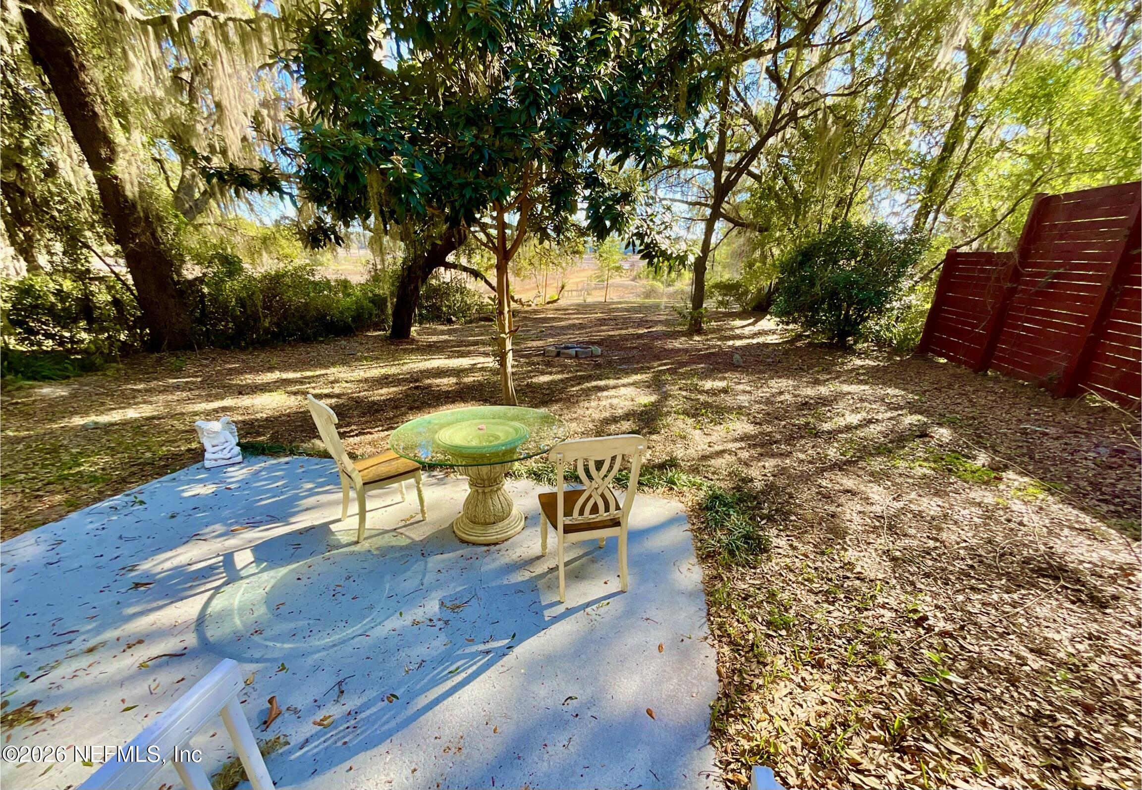 111 2nd Street Melrose, FL 32666 - Photo 24 of 36 a view of a yard with wooden floor