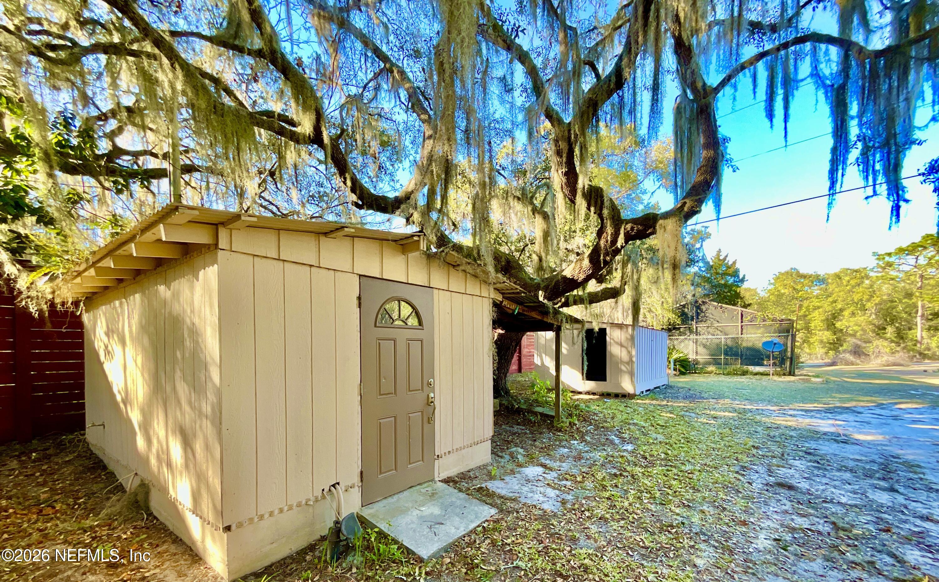 111 2nd Street Melrose, FL 32666 - Photo 27 of 36 a view of a street with a tree