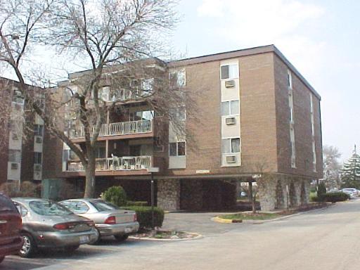 a front view of a building with street view
