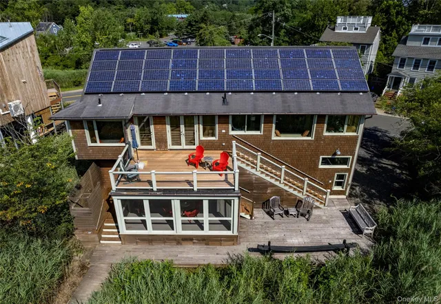 a front view of a building with a garden