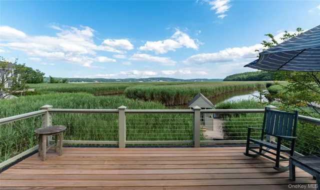 a view of a wooden deck with a bench