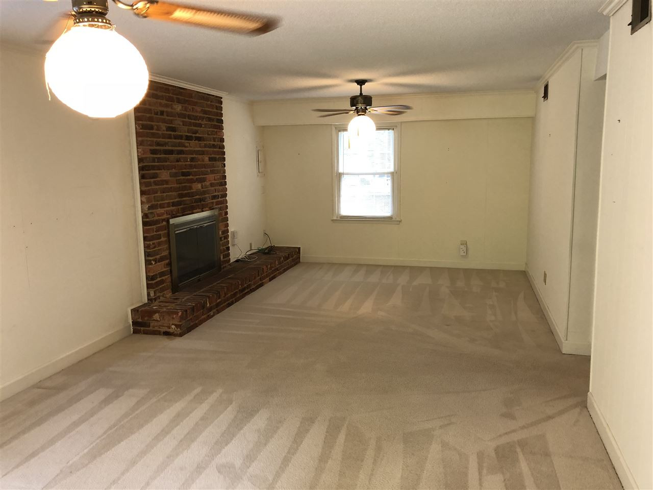 709 Dartmouth Road Raleigh, NC 27609 - Photo 10 of 25 Large open family room with many possibilities and fireplace and sliding doors to a private patio. Family Room Lower Level