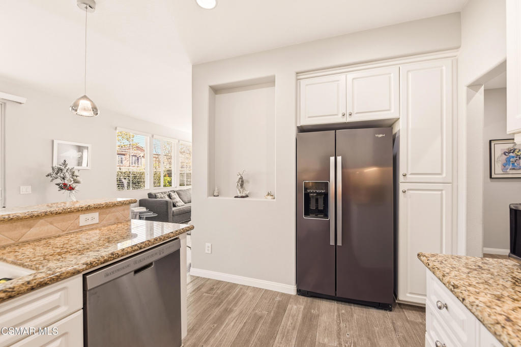 2964 Camelita Way, Unit C Simi Valley, CA 93063 - Photo 12 of 42 a kitchen with granite countertop a refrigerator and a sink