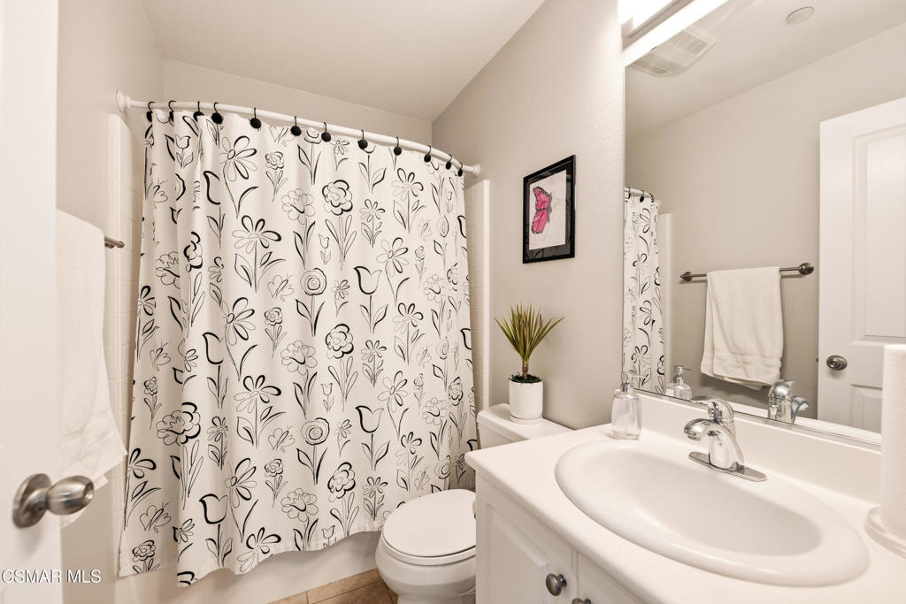 2964 Camelita Way, Unit C Simi Valley, CA 93063 - Photo 19 of 42 a bathroom with a white toilet sink and a mirror