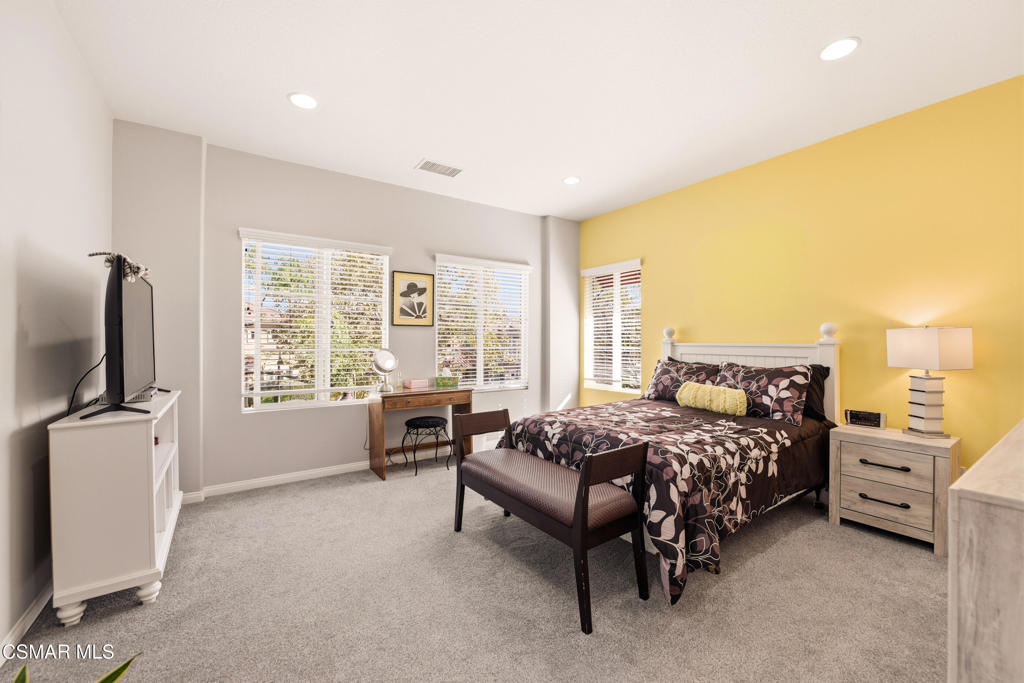 2964 Camelita Way, Unit C Simi Valley, CA 93063 - Photo 23 of 42 a bedroom with a bed and a flat screen tv