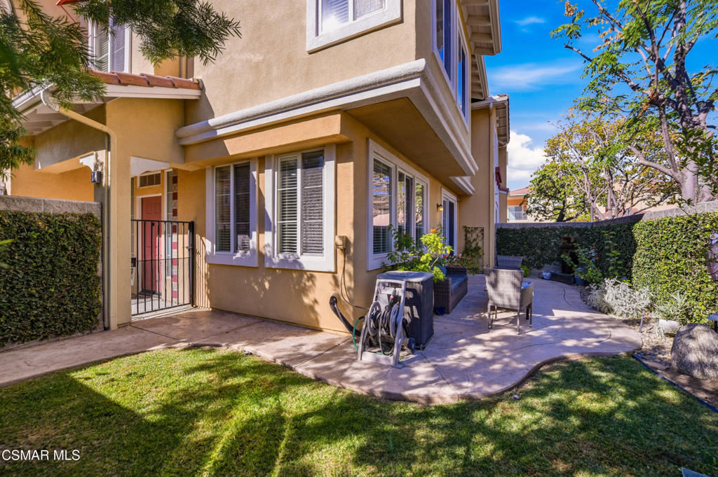 2964 Camelita Way, Unit C Simi Valley, CA 93063 - Photo 34 of 42 a view of a patio with table and chairs and potted plants