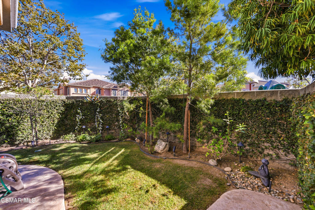 2964 Camelita Way, Unit C Simi Valley, CA 93063 - Photo 36 of 42 a view of a yard with plants and a fountain