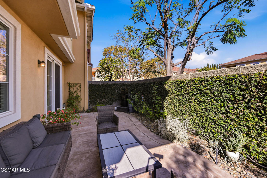 2964 Camelita Way, Unit C Simi Valley, CA 93063 - Photo 37 of 42 a view of a porch with chairs and potted plants