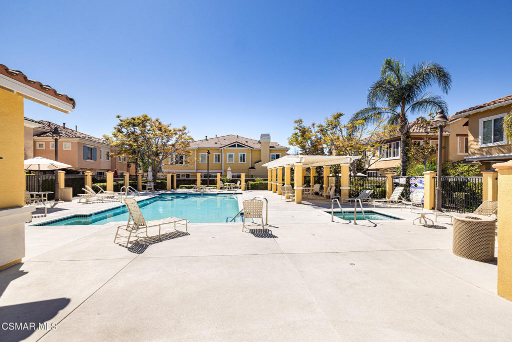 2964 Camelita Way, Unit C Simi Valley, CA 93063 - Photo 42 of 42 a view of tall buildings with cars parked