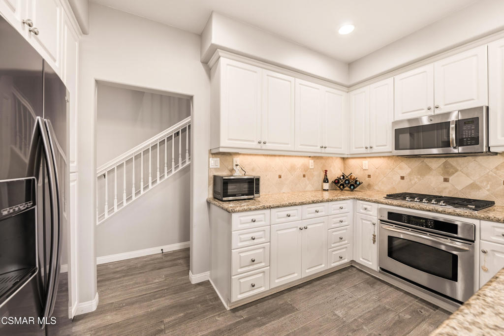 2964 Camelita Way, Unit C Simi Valley, CA 93063 - Photo 10 of 42 a kitchen with cabinets stainless steel appliances and a window