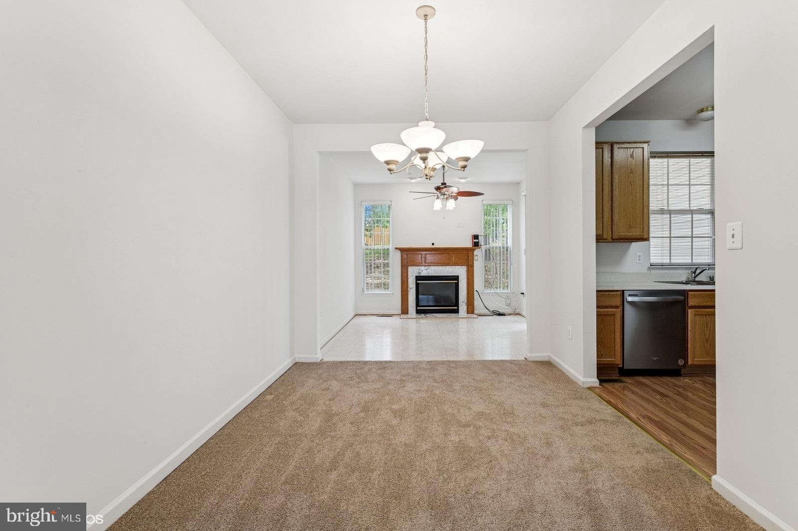 7315 Serenade Circle Clinton, MD 20735 - Photo 12 of 36 a view of livingroom with kitchen and chandelier